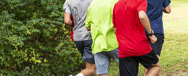 A Group Of High School Boys Are Running During Cross Country Pra